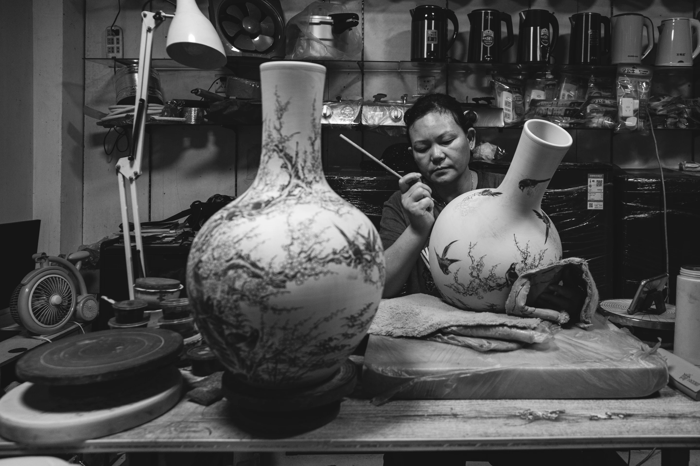 We dropped by her store and saw her painting on pottery